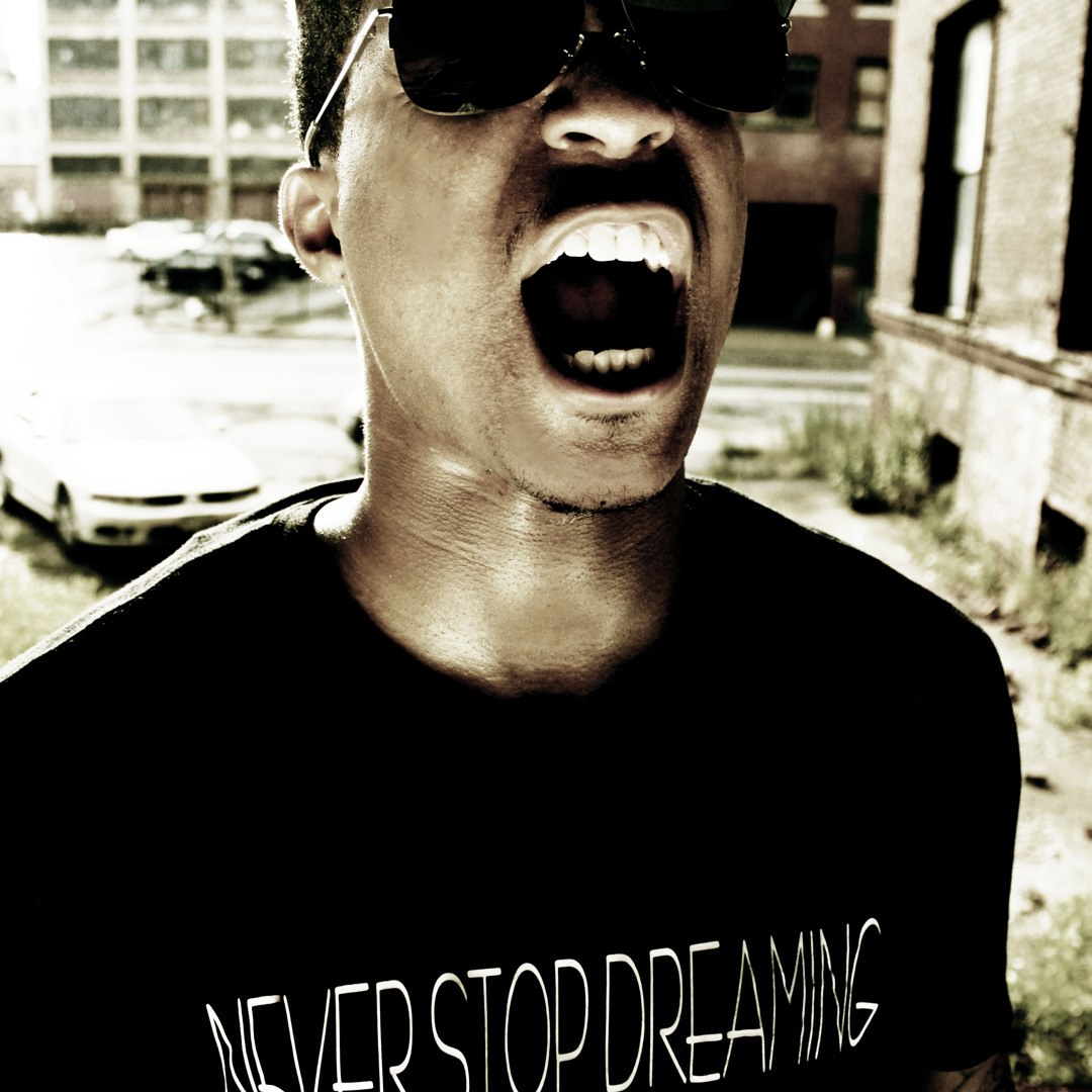 Chiefalone wearing a Never Stop Dreaming shirt